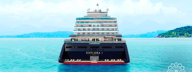 Explora Journeys Kreuzfahrtschiff in der Karibik bei Sonnenuntergang